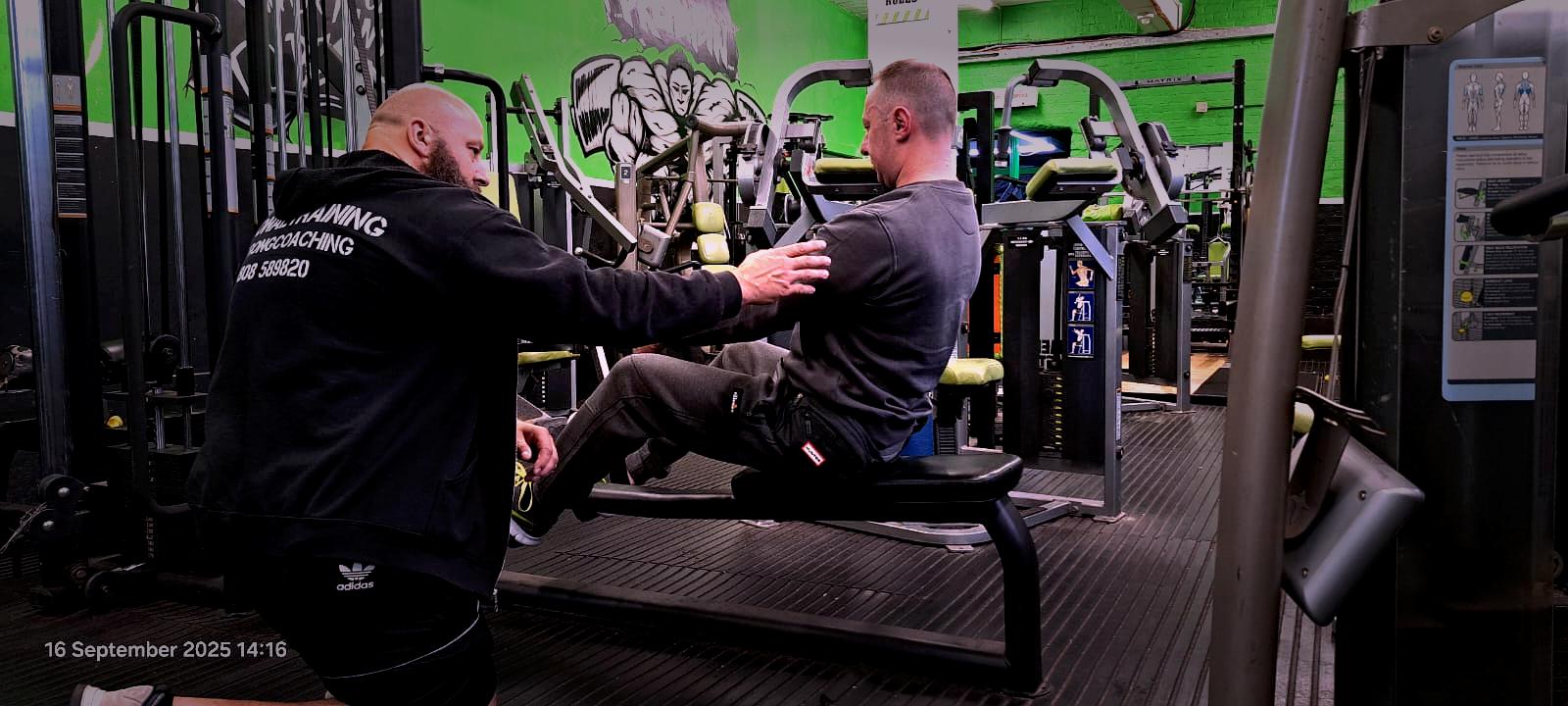 Personal trainer coaching exercise technique